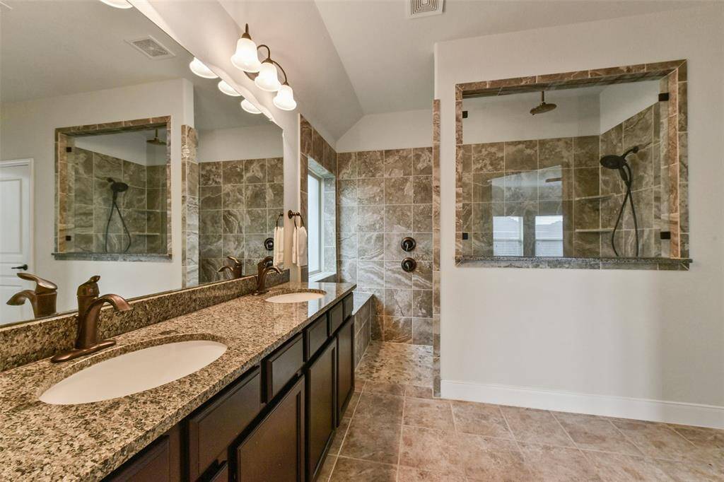 Ensuite bath with super size shower.