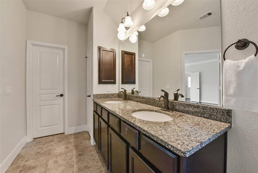 Double sink granite vanity. Two separate walk-in closets!