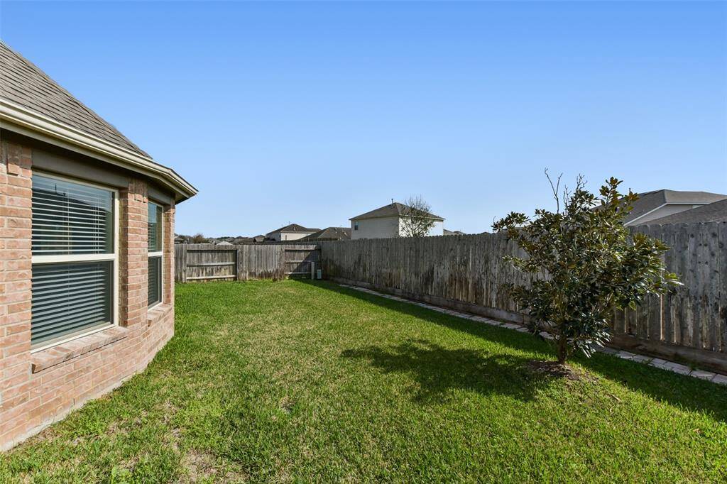 Backyard. This home has a full automatic sprinkler system!