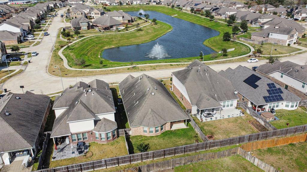 Aerial view from the back of the home. This home has a serene view of the lake and fountain!