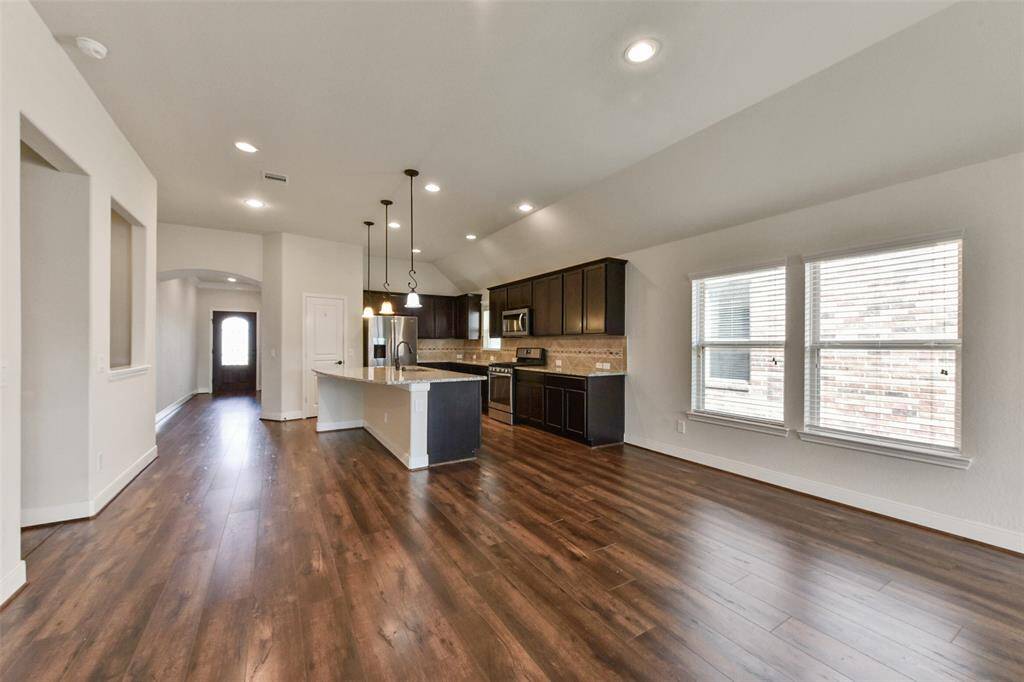 The wood laminate floors extend throughout the entry, study, bedrooms and living areas. No carpet in the entire home!