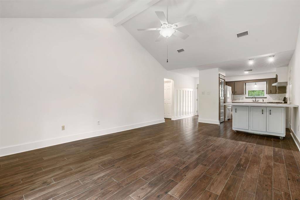 Vaulted ceiling with neutral color palette enhancing the bright and airy feel.