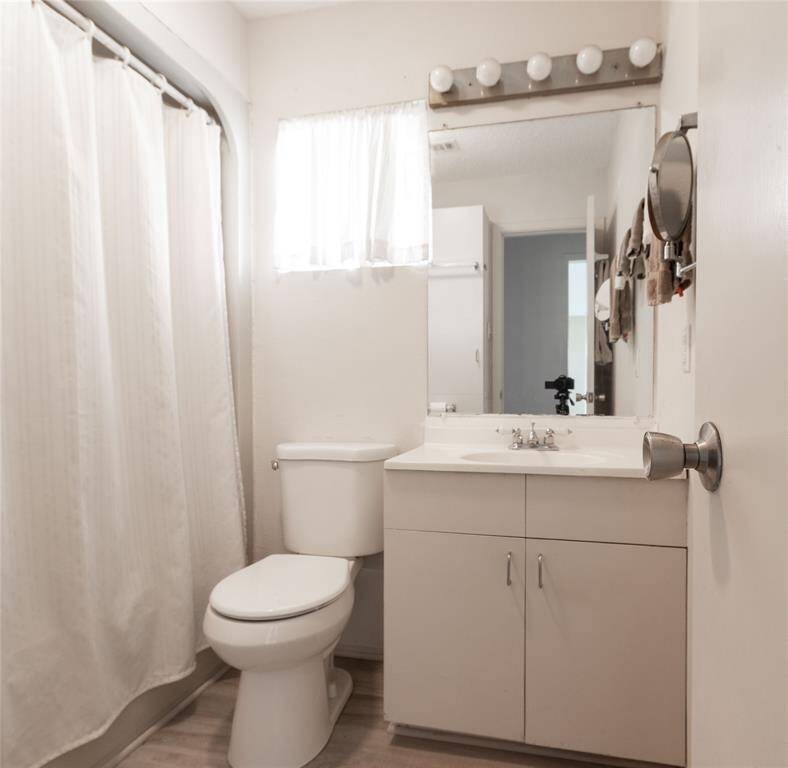 Stylish and bright primary bathroom with modern fixtures.