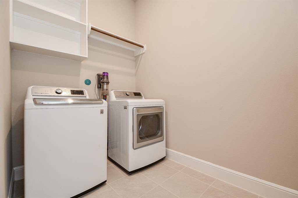 Utility room has built in shelves and hanging rod. Washer and Dryer are not included.
