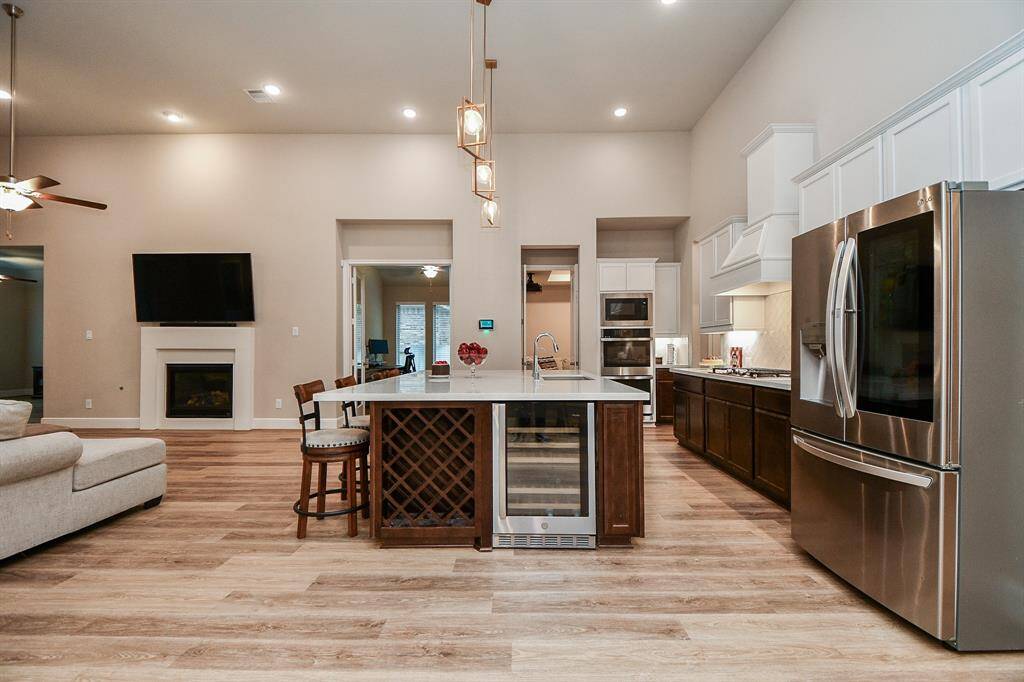 The kitchen seamlessly connects to the media room and study.
