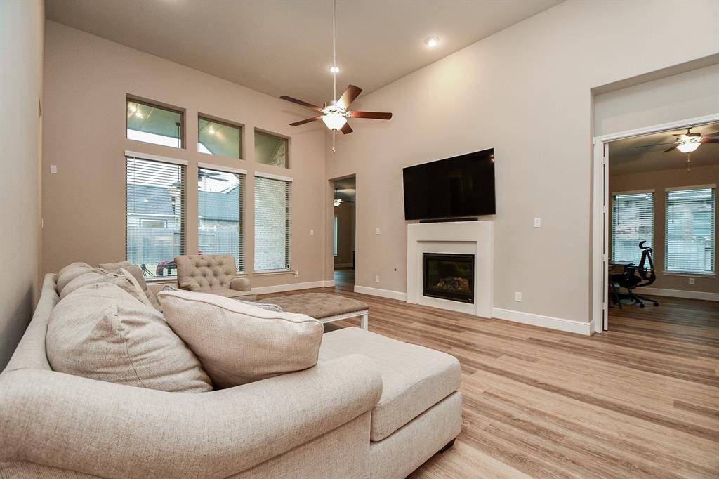 Living room has access to adjoining rooms: home office, gameroom, bathroom and 4th bedroom,  Ideal for comfortable living and entertaining.