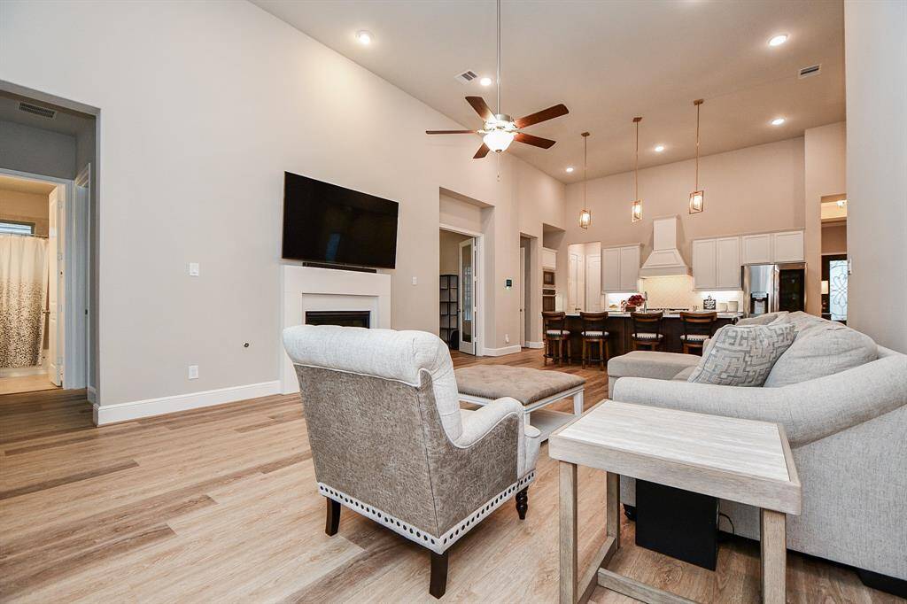 View from the living room, on the left, shows the hallway to the 4th bedroom, hall bathroom and gameroom.