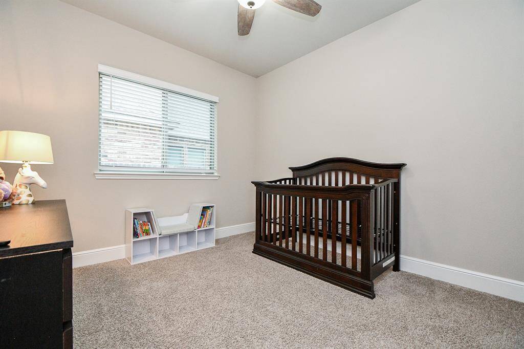 4th bedroom has ceiling fan and windows facing the side of the home