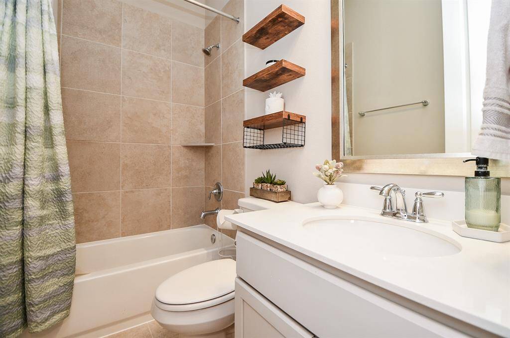 A hall bathroom is adjacent to the 3rd bedroom.