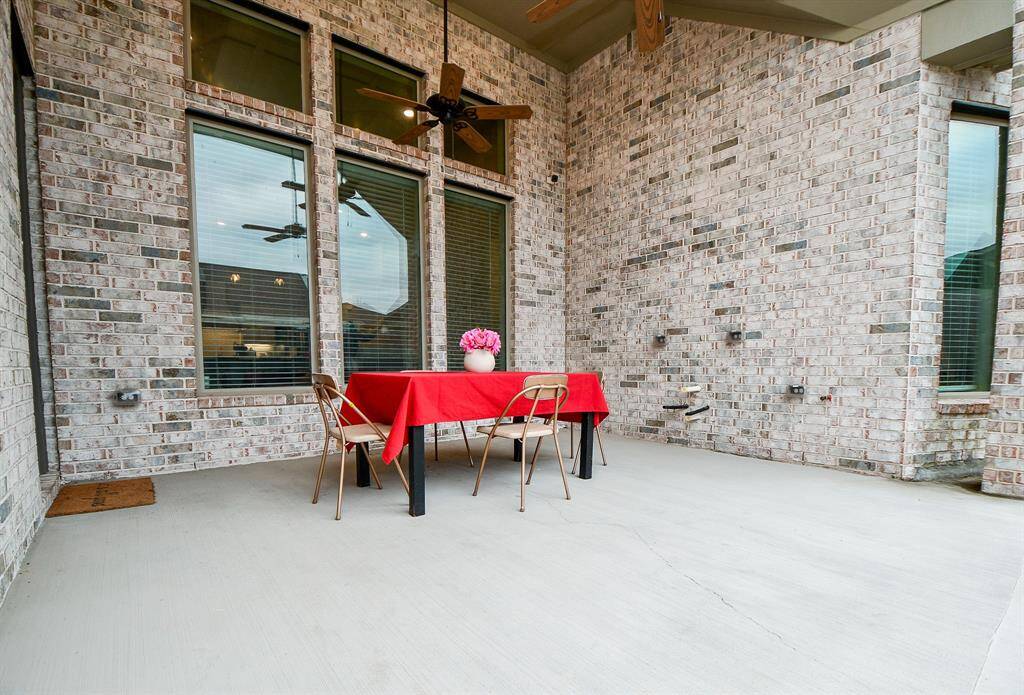 This Texas size covered patio has plenty of room for outdoor furniture.  It is pre-plumb and has gas connection and ready for an outdoor kitchen!