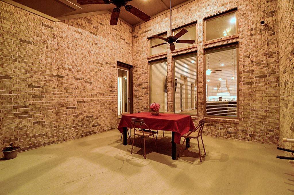 This impressive covered patio has 2 ceiling fans.