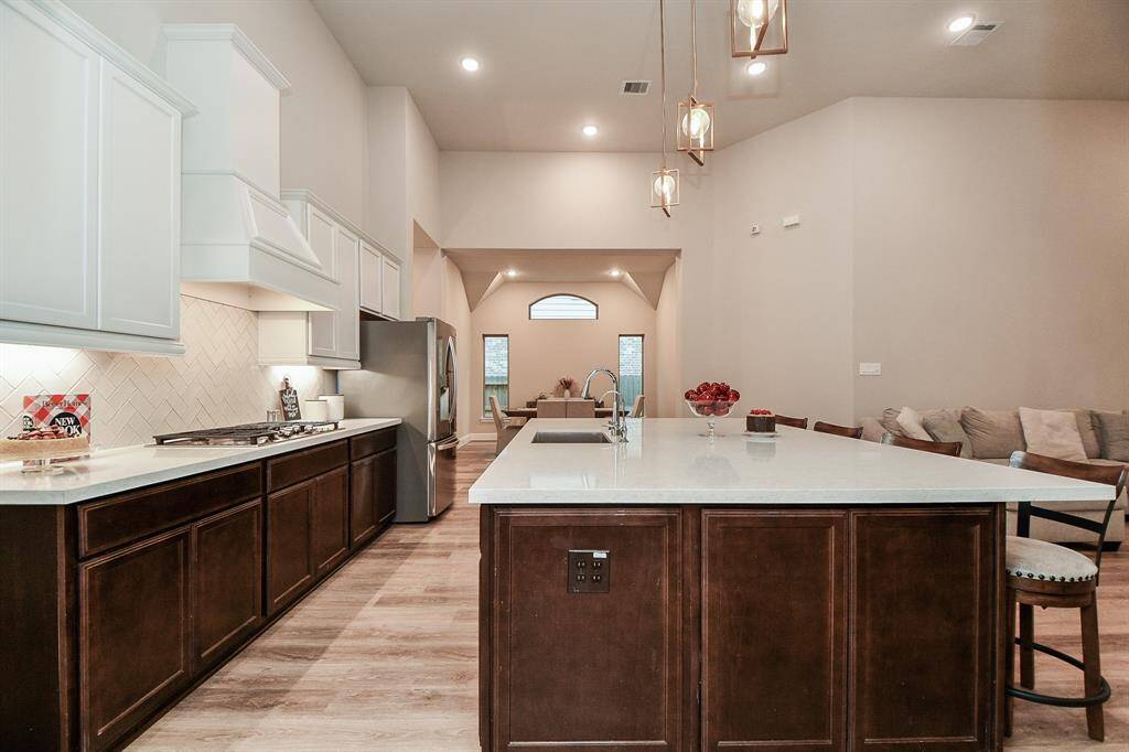 This kitchen flows into a bright dining area perfect for entertaining.
