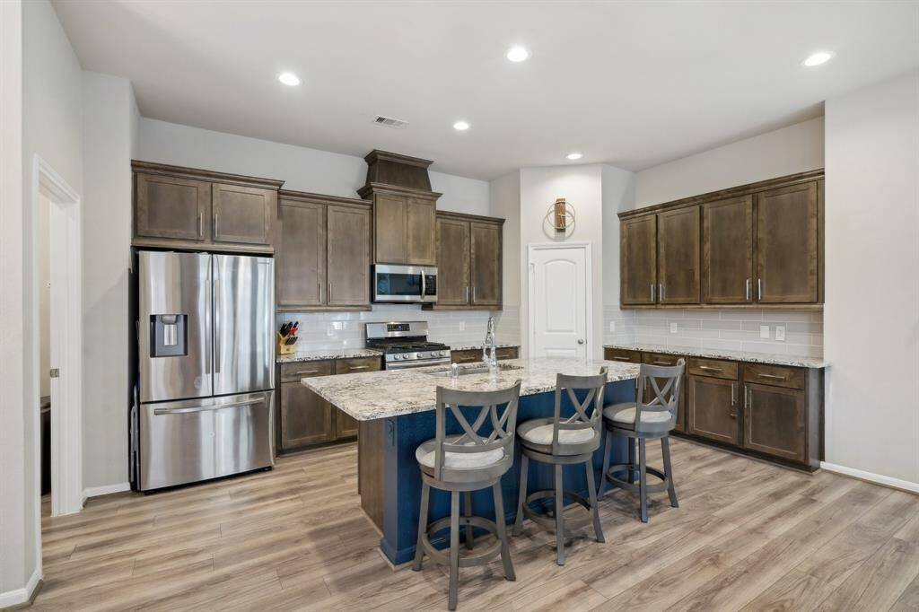 Living room opens to kitchen