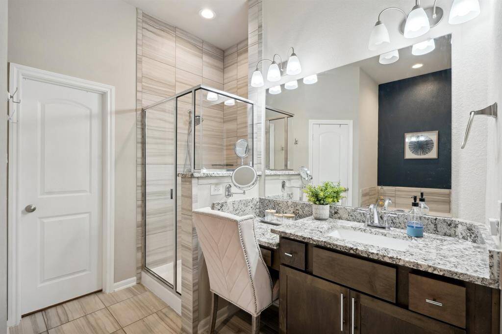 Sliding barn door that leads to primary bathroom