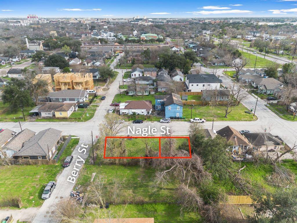 This view places the lot within its neighborhood, surrounded by a blend of established homes and new developments, reflecting the area’s steady transformation.