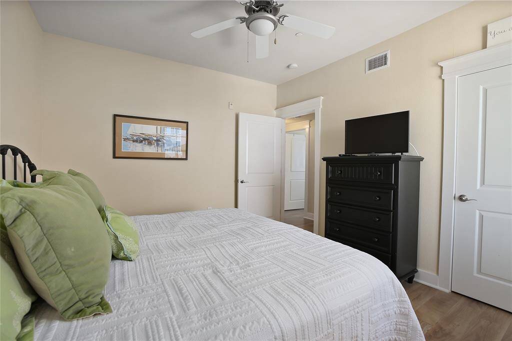 A spacious layout, stylish furnishings, and a calming ambiance make this guest bedroom a perfect retreat for relaxation.