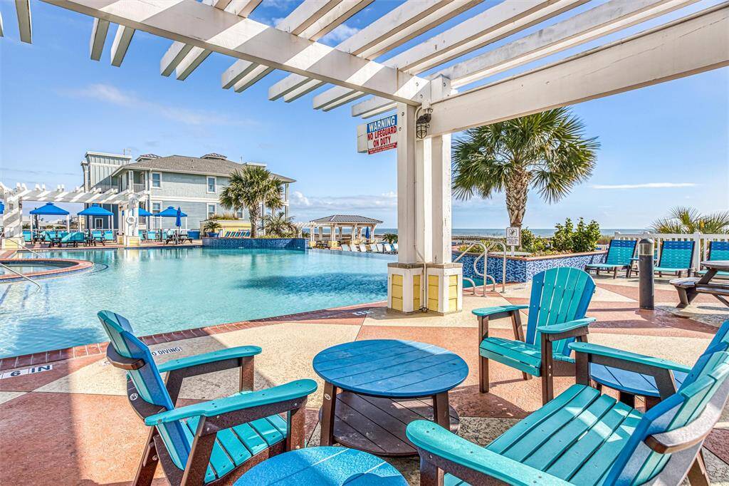Relax by the infinity-edge pool,featuring shaded seating andvibrant lounge chairs, alloverlooking the breathtaking Gulfviews.