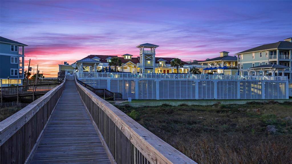 Stroll down the scenic boardwalkat sunset, leading to thebeautifully illuminated BeachClub, where luxury meetscoastal charm.