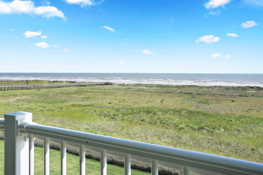 Enjoy endless coastal serenity with panoramic views of protected dunes, a scenic boardwalk, and the shimmering Gulf waters.