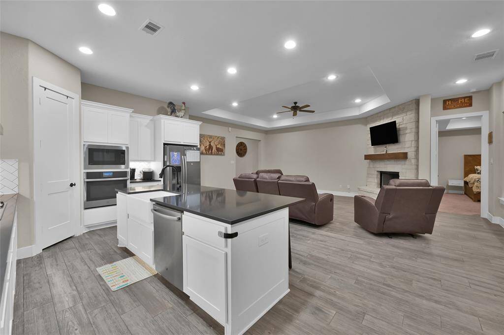 This inviting open-concept floorplan fosters seamless connectivity and togetherness.