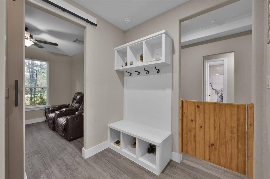 The mudroom offers convenient access between the garage and home entrance.