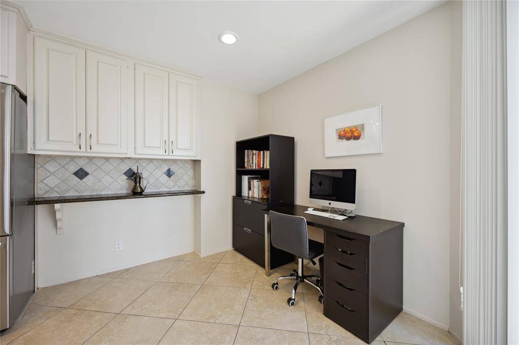 Cozy breakfast nook to enjoy coffee with a view or use as flex space for additional home office