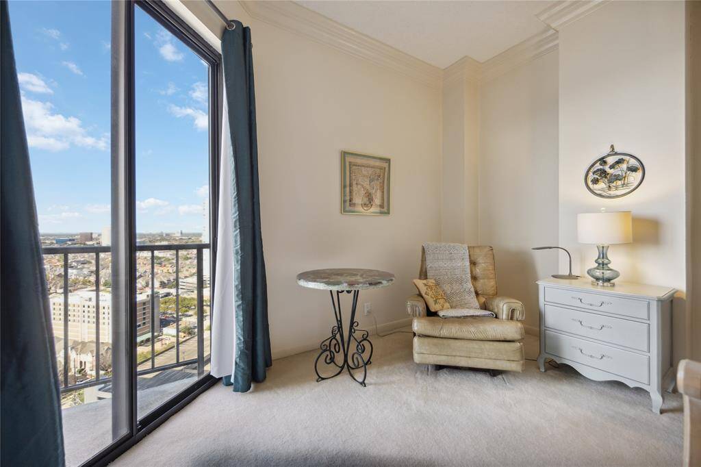 Floor to ceiling sliding doors to enjoy the balcony from the primary bedroom