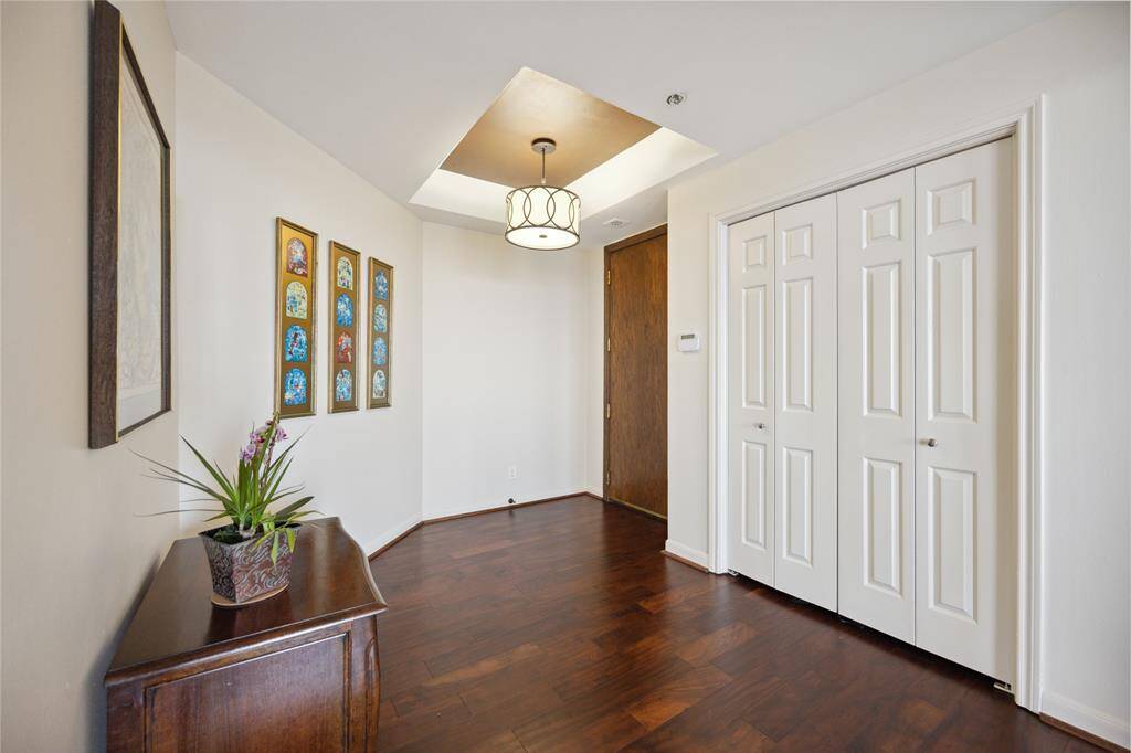 Step into elegance with this wide formal entry with large coat closet