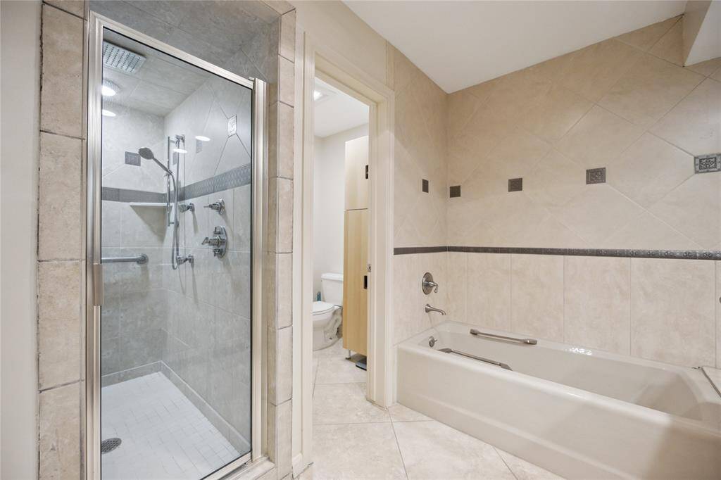 Updated tile throughout en-suite bathroom, separate water closet for privacy