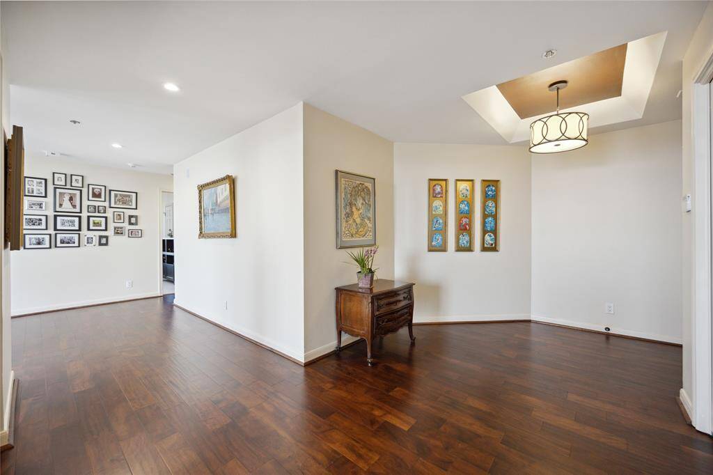 Grand foyer spills into the rest of the living area - beautiful wood floors and high ceilings