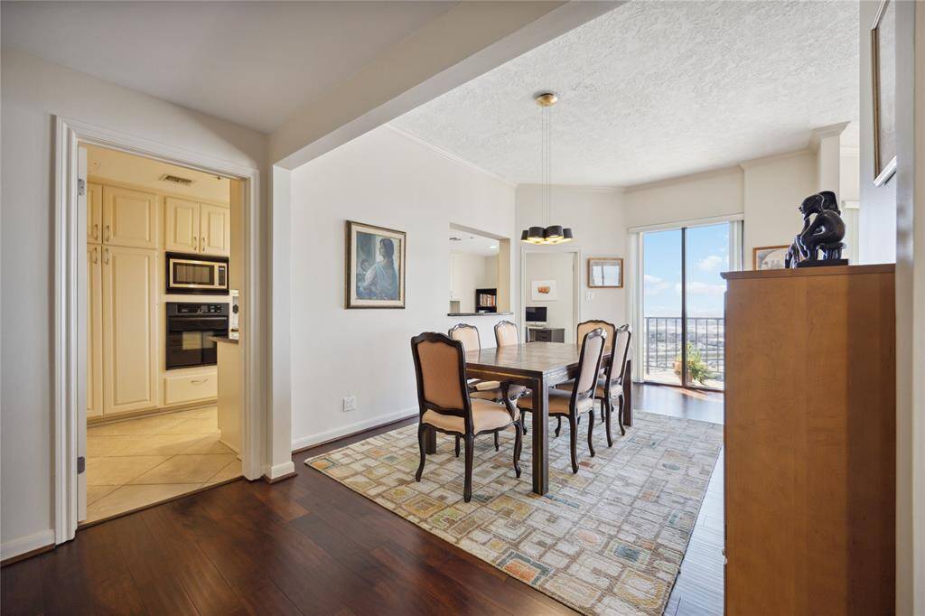 Formal dining room with elegant lighting fixture and enough space to accommodate guests