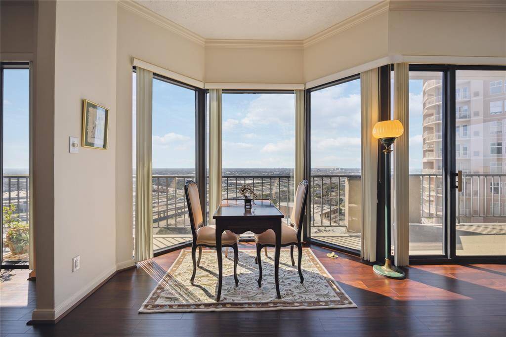 Floor to ceiling windows and high ceilings throughout the living space