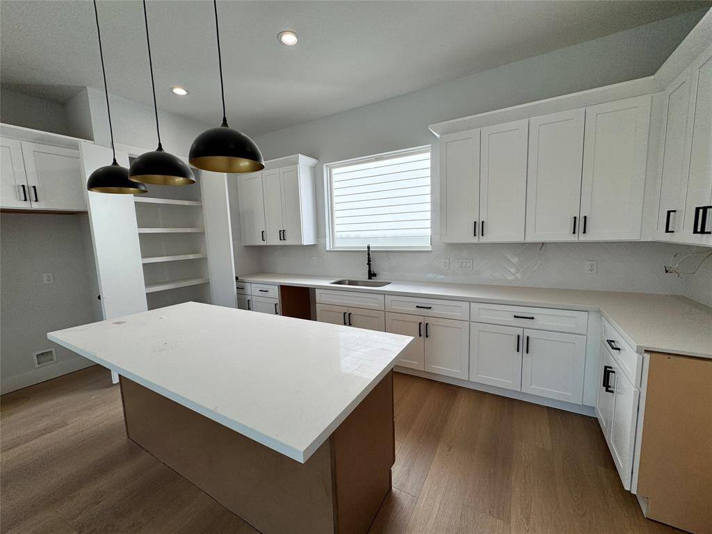 Quartz countertop & plenty storage in overhead cabinets