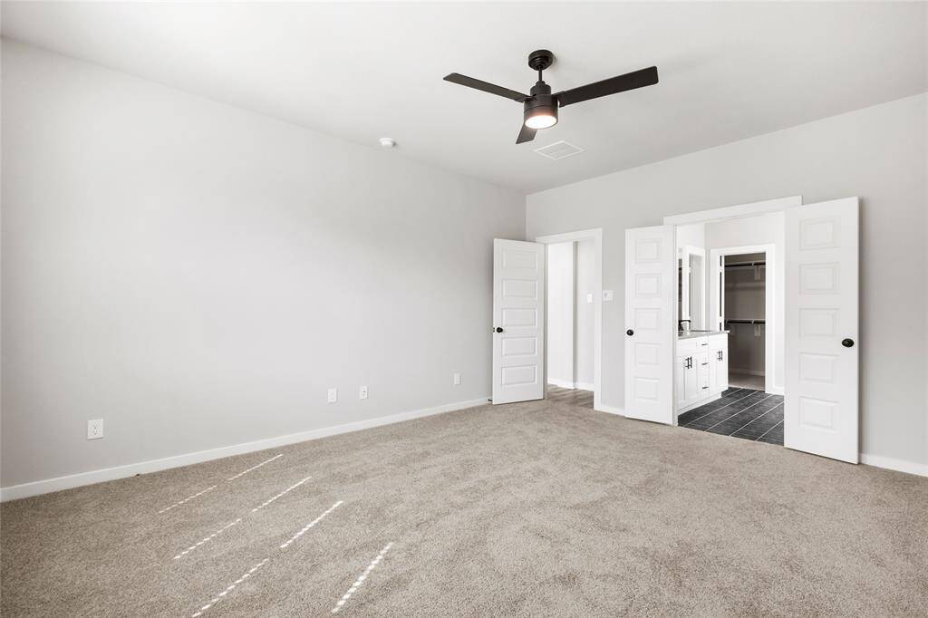 This modern two-story home features a spacious front yard, a double garage, and a sleek exterior design with neutral tones. Located in a suburban neighborhood, it offers a welcoming atmosphere and ample living space.