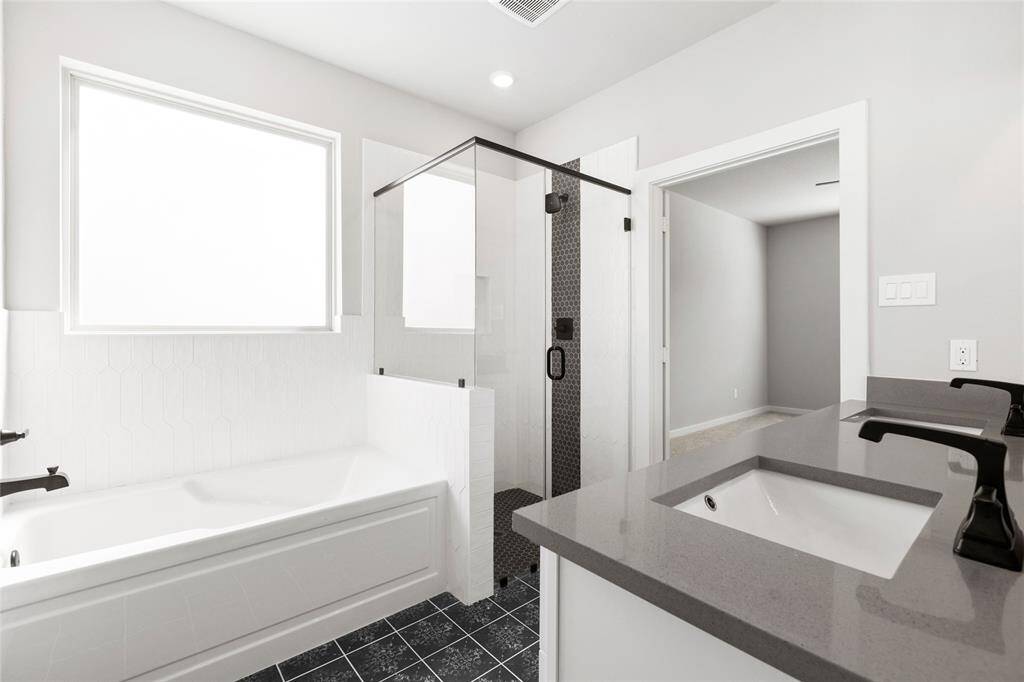 This modern two-story home features a spacious front yard, a double garage, and a sleek exterior design with neutral tones. Located in a suburban neighborhood, it offers a welcoming atmosphere and ample living space.
