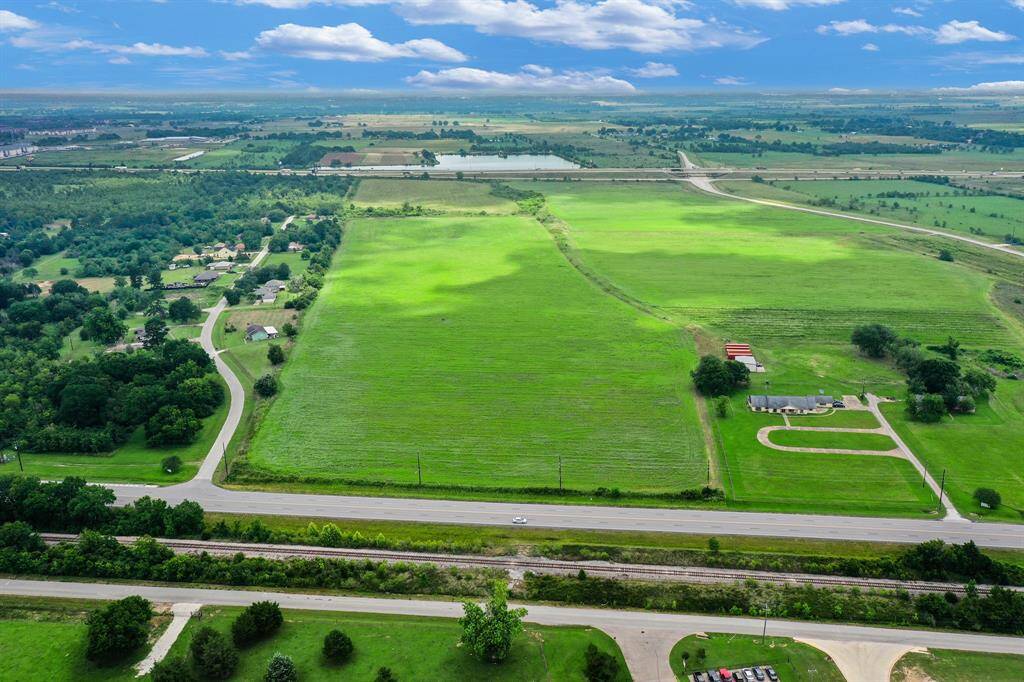 North-facing view of current access road from old Business Hwy 290.