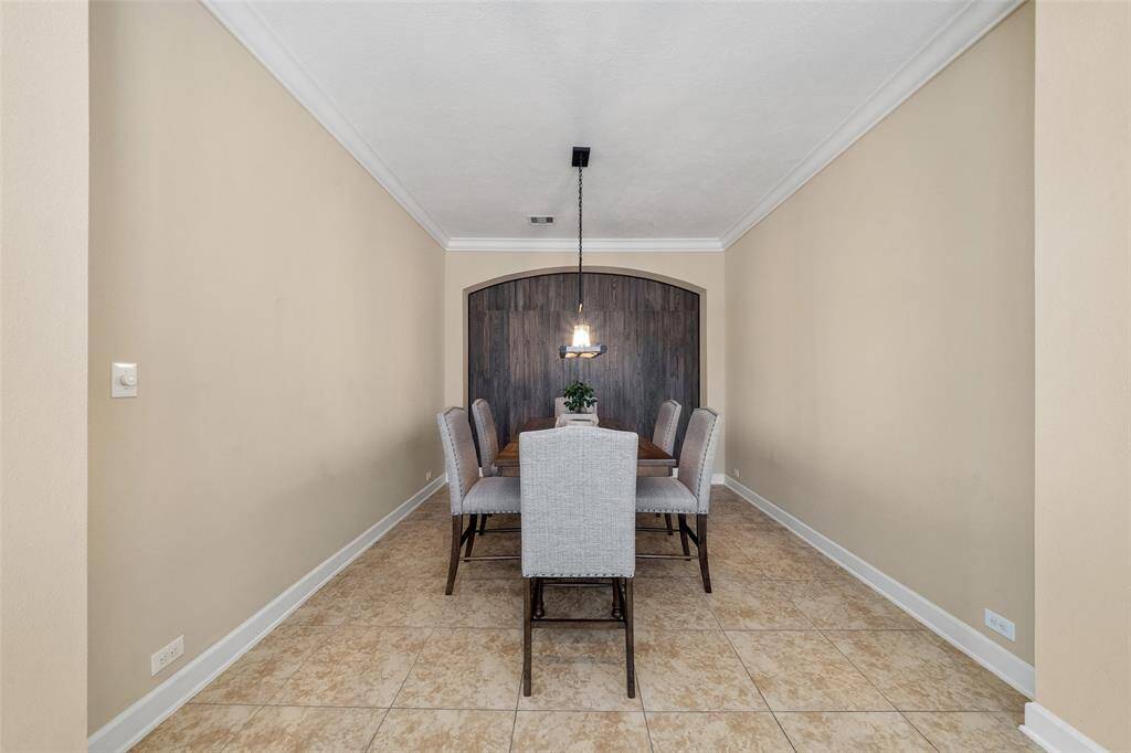 Another view of the dining area with accent wall