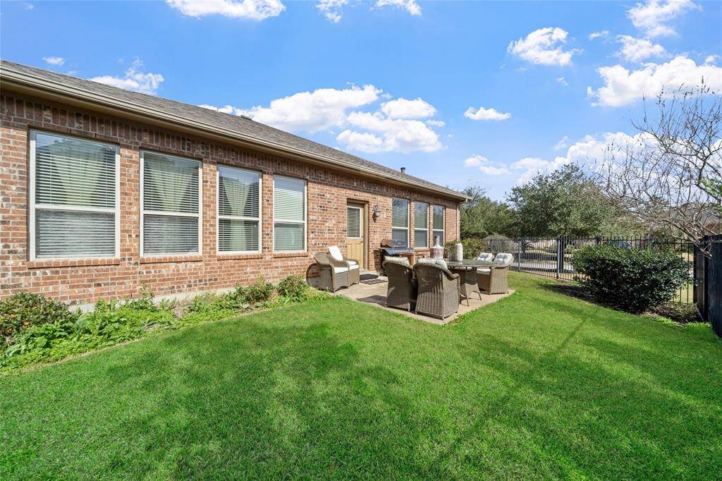 The back patio area is perfect for outdoor relaxation or entertaining.
