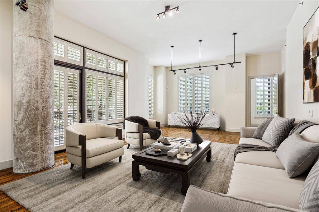 Expansive, open floorplan allowing for wonderful entertainment spaces. This room has been virtually staged to reflect a possible furniture placement. Enjoy access to one of three balconies.