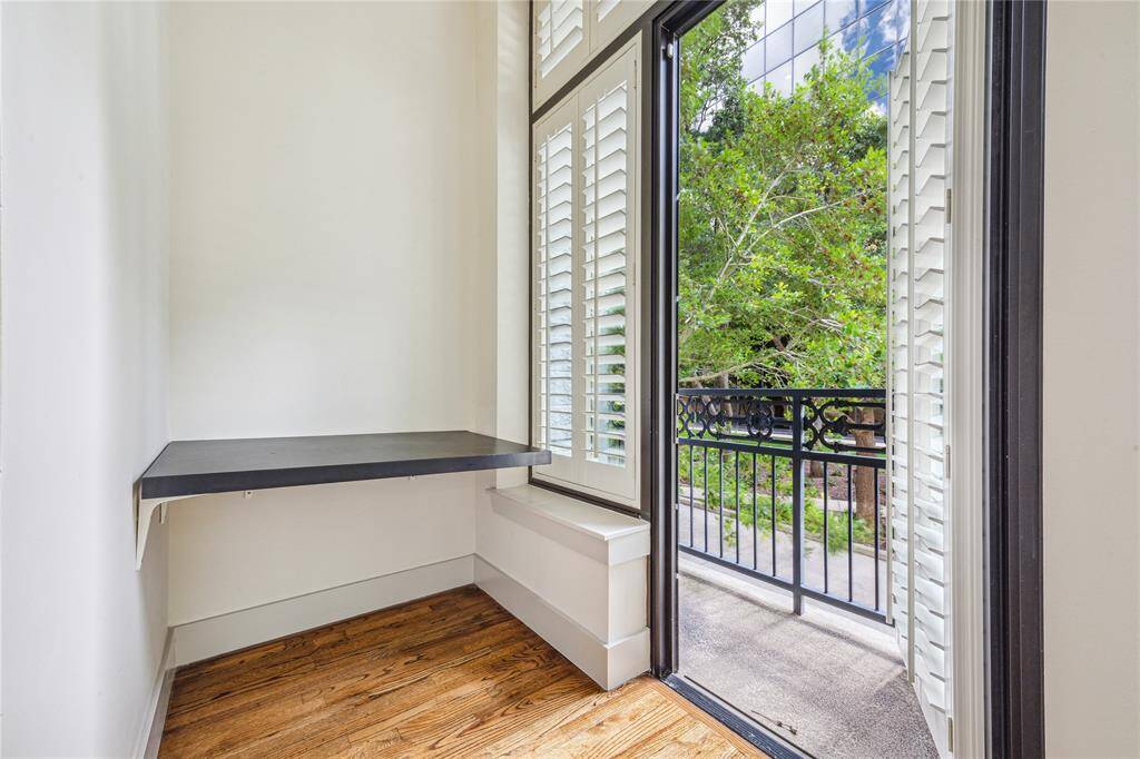 A convenient breakfast nook just off the kitchen with balcony access (one of three).
