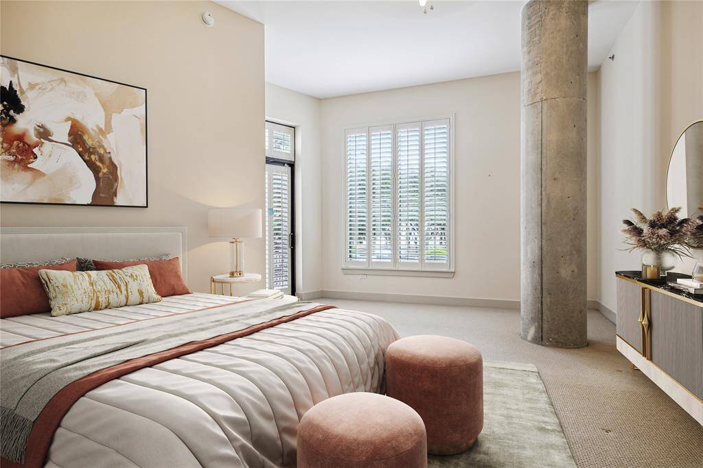 The Primary Bedroom boasts high ceilings, Plantation shutters and its own balcony. Expansive walls for art and furniture placement. (virtually staged)