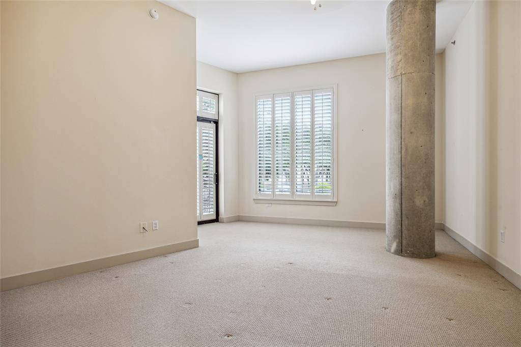 The Primary Bedroom boasts high ceilings, Plantation shutters and its own balcony. Expansive walls for art and furniture placement.