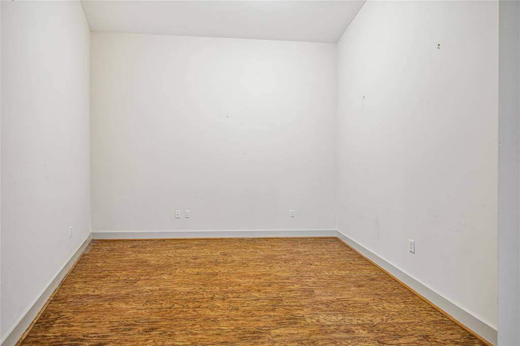 One of the Secondary Bedrooms with high ceilings and great walls. Would also be a great Study.