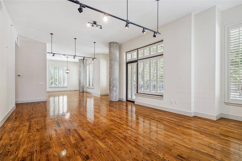 A different view of the Living Room towards the Kitchen. Plantation shutters throughout A different view of the Living Room. Enjoy lots of different furniture placement possibilities.