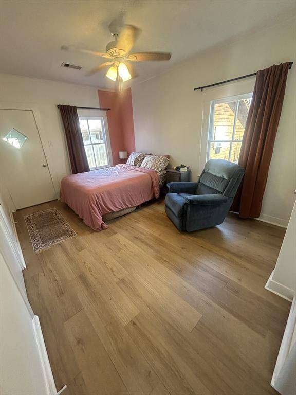Primary bedroom measures 10x9.  Utility room door in the background to the left. Bathroom entrance to the immediate left.