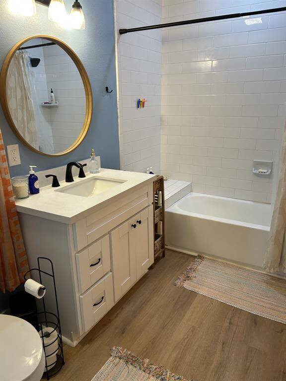 Full bath with tub w/shower.