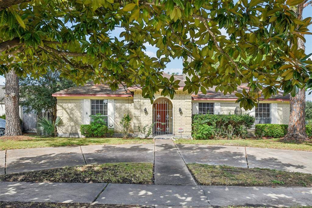Front of house shaded with trees