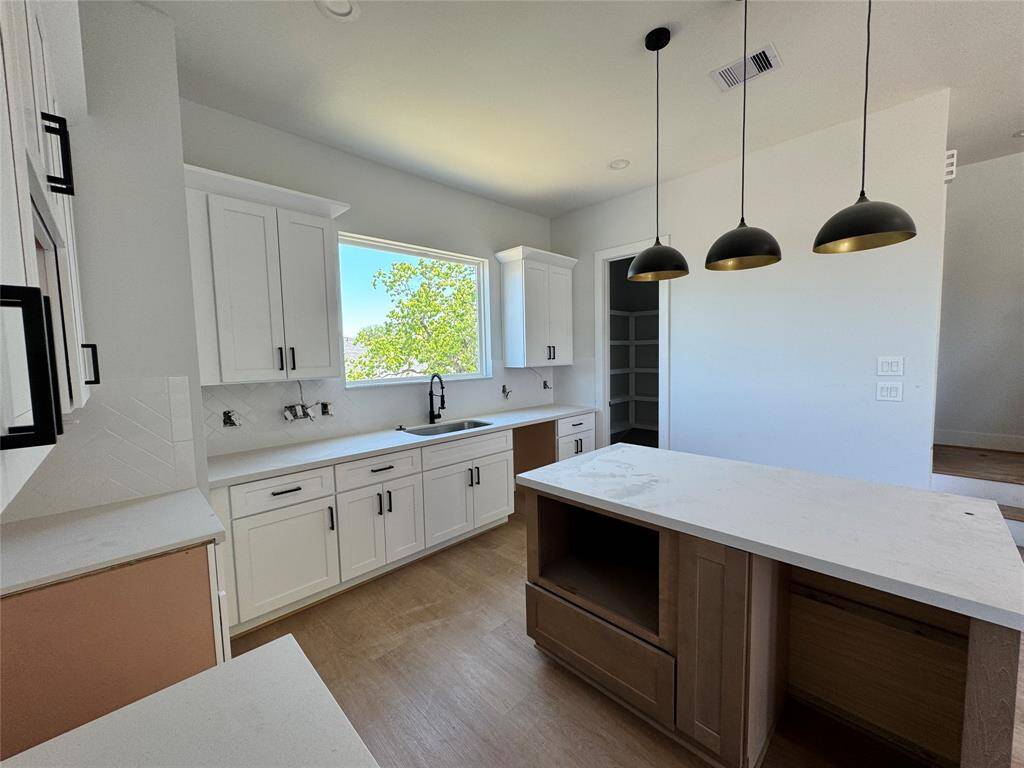 Quartz counter top with tons of Cabinet storage