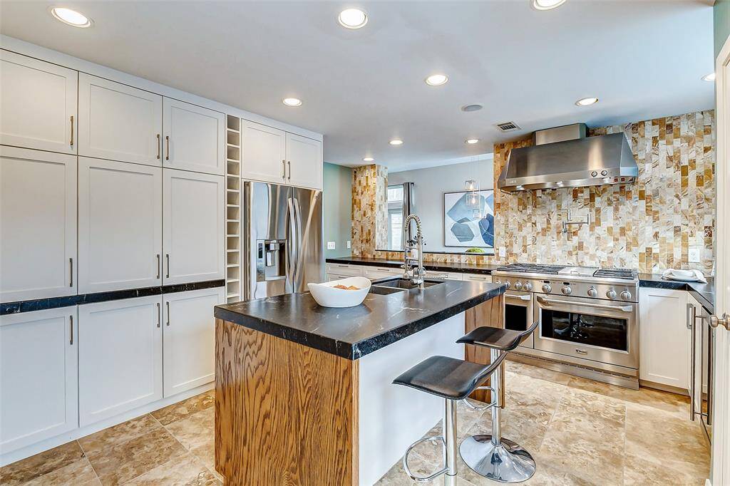 This updated kitchen offers abundant storage.