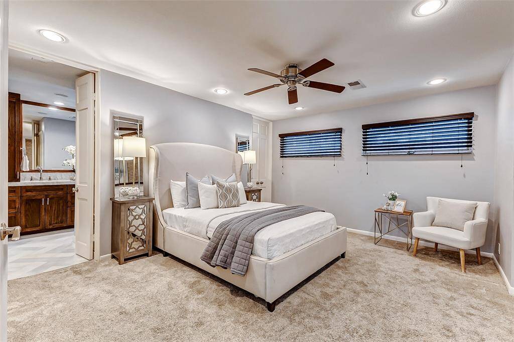 Spacious downstairs primary bedroom with three closets and a beautifully updated en-suite bath.